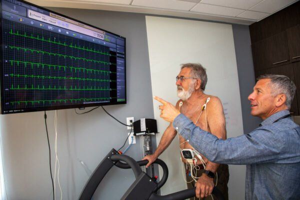 Doctor and patient looking at stress test results
